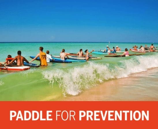 people in paddle boats in ocean