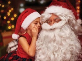 Santa with child whispering