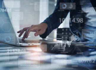 Businesswoman working on laptop computer analyzing sales data and economic growth graph chart. Business strategy, digital market report analysis, data scientist
