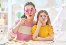 Mother and daughter with paper crowns