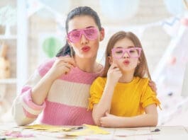 Mother and daughter with paper crowns