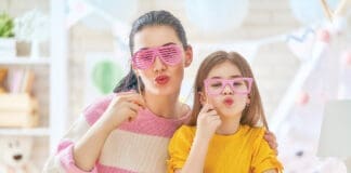 Mother and daughter with paper crowns