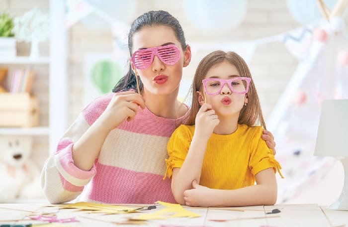 Mother and daughter with paper crowns
