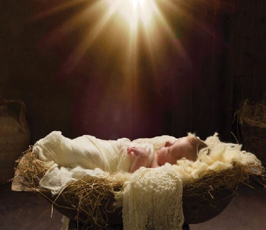 Jesus Baby in Manger iStock 1759710489