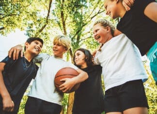 Kids playing basketball iStock 2243962299