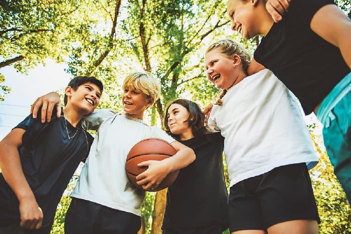 Kids playing basketball iStock 2243962299