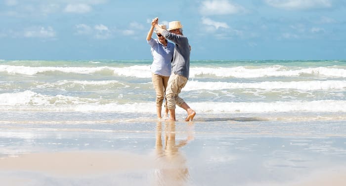 Senior Couple Dancing on Beach iStock 1322107306