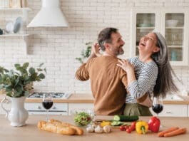 Happy Couple in Kitchen iStock 1328351784