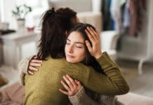 Bring Hope Now: Local Nonprofit Aims to Solve Youth Mental Health Crisis Teenager Hugging Parent iStock 1476266423