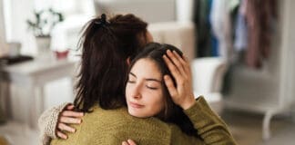 Teenager Hugging Parent iStock 1476266423