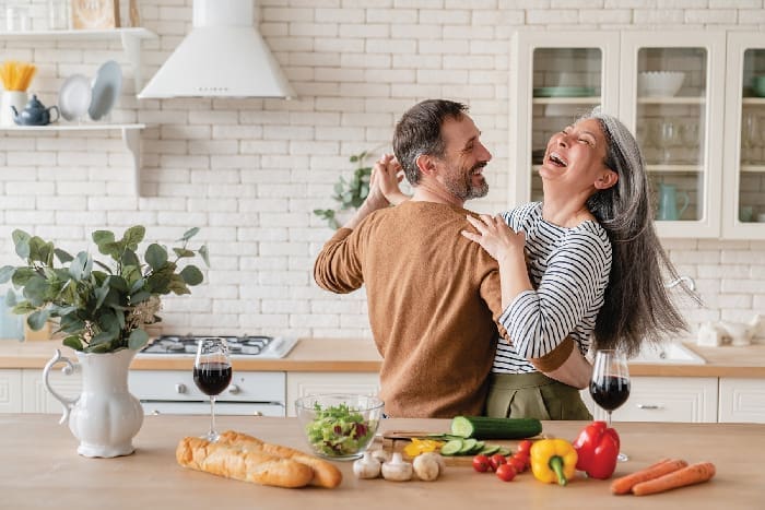 Happy Couple in Kitchen iStock 1328351784