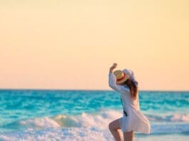 Happy Woman on Beach iStock 816521498