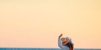 Happy Woman on Beach iStock 816521498