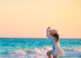 Happy Woman on Beach iStock 816521498