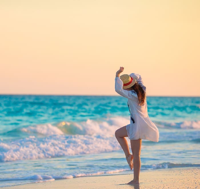 Happy Woman on Beach iStock 816521498